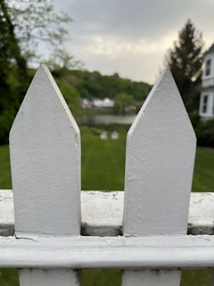A wide shot of a residential property surrounded by sleek, low-maintenance WPC fencing on a clear day.