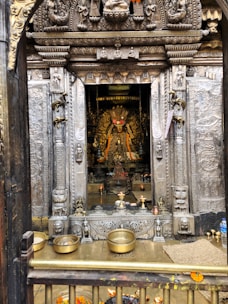 Devotees offering flowers at the entrance of the Jagannath Temple in Puri during morning prayers.