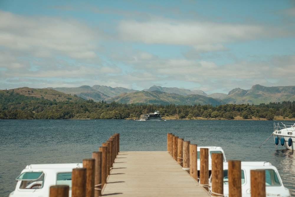 a boat is docked at the end of a pier