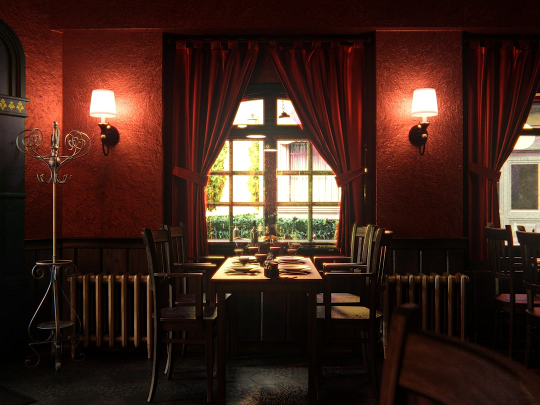a dimly lit dining room with red walls,