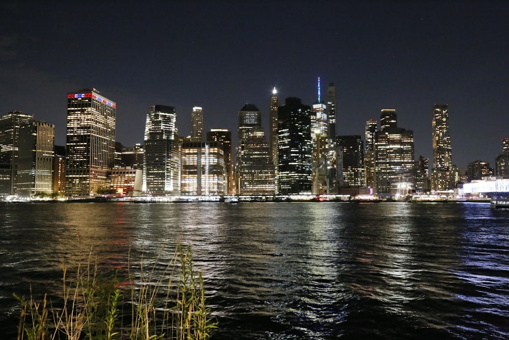 a view of a city at night from the water