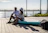 Couple enjoying drinks on the spacious deck of the boat surrounded by turquoise waters.