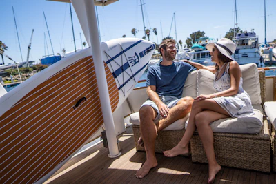 Travel consultant discussing cruise options with a happy couple in a stylish office.