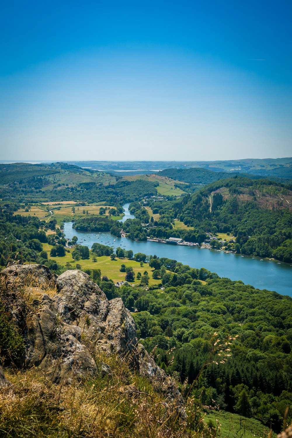 a scenic view of a river and a valley