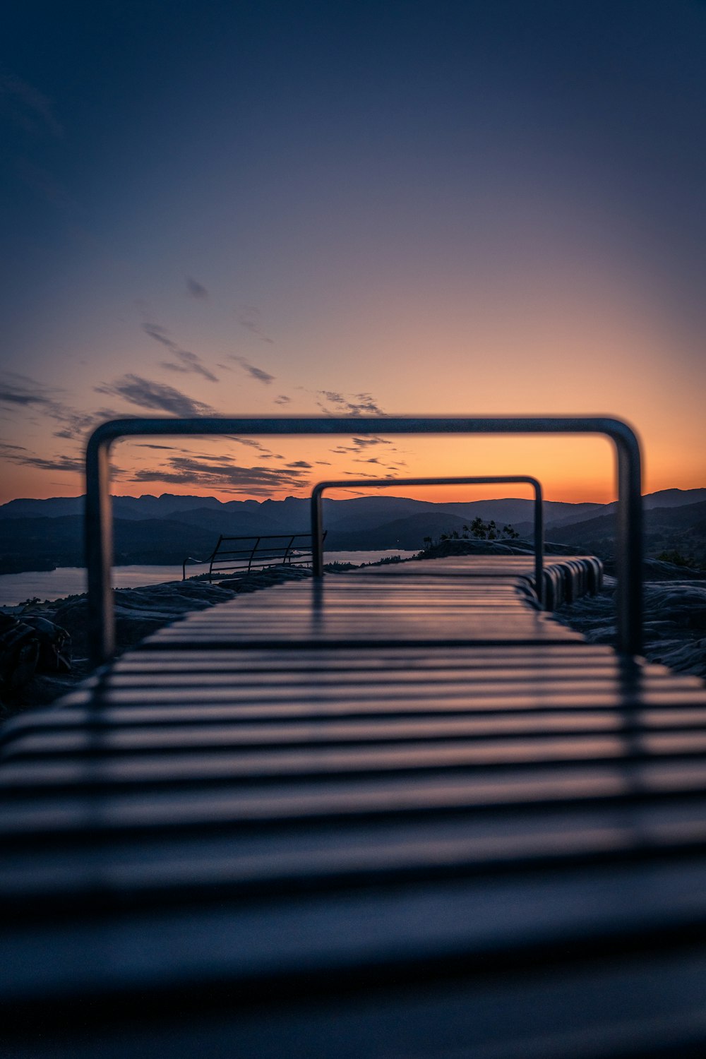 a view of a dock with a sunset in the background