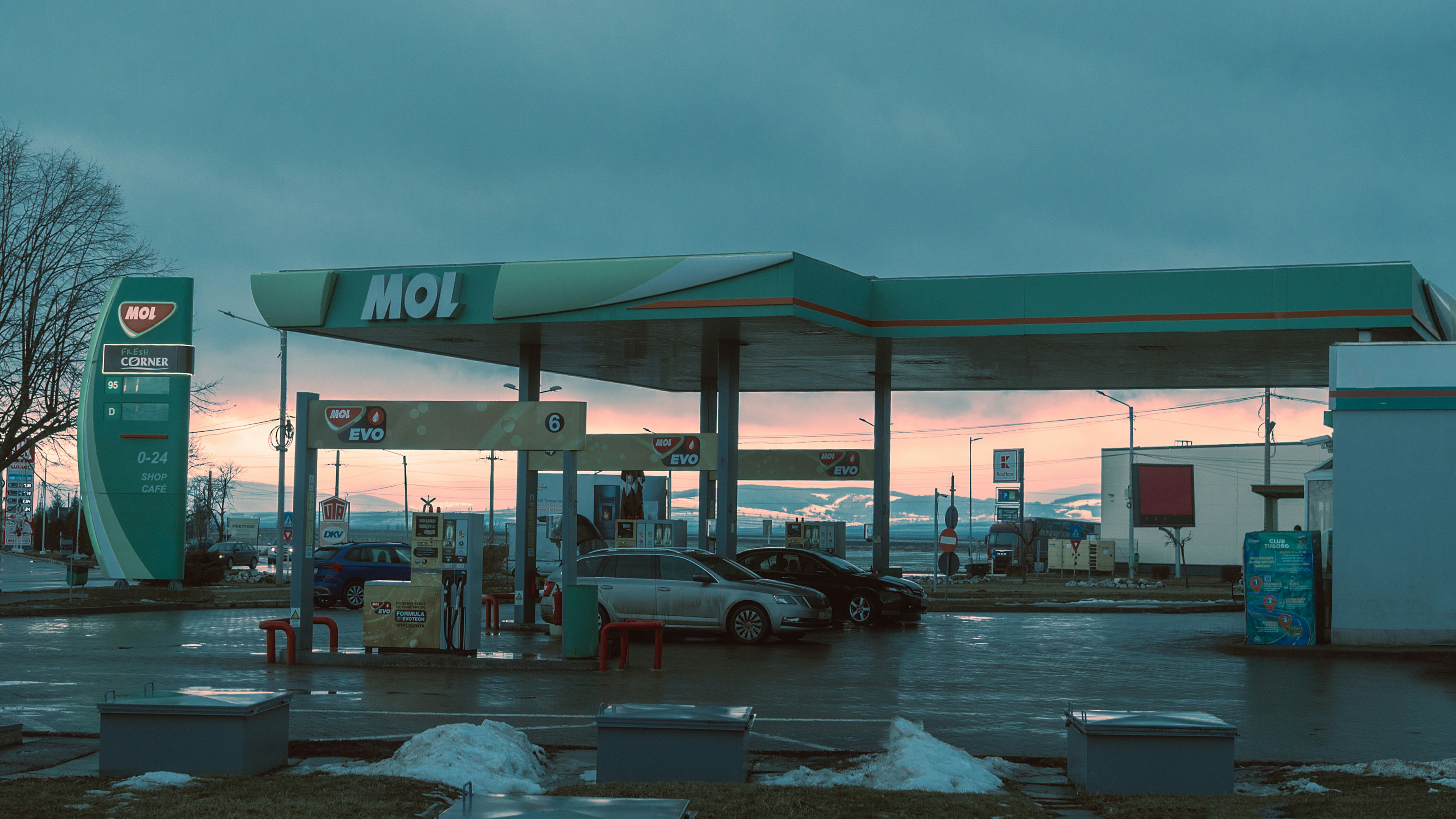 a car is parked at a gas station