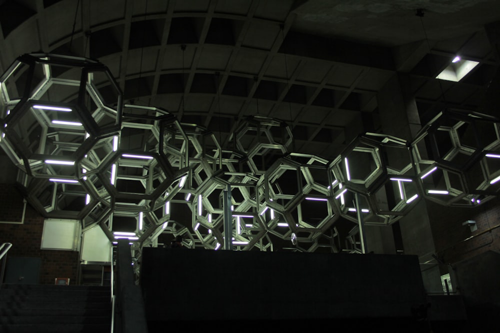 a building with a bunch of mirrors hanging from it's ceiling