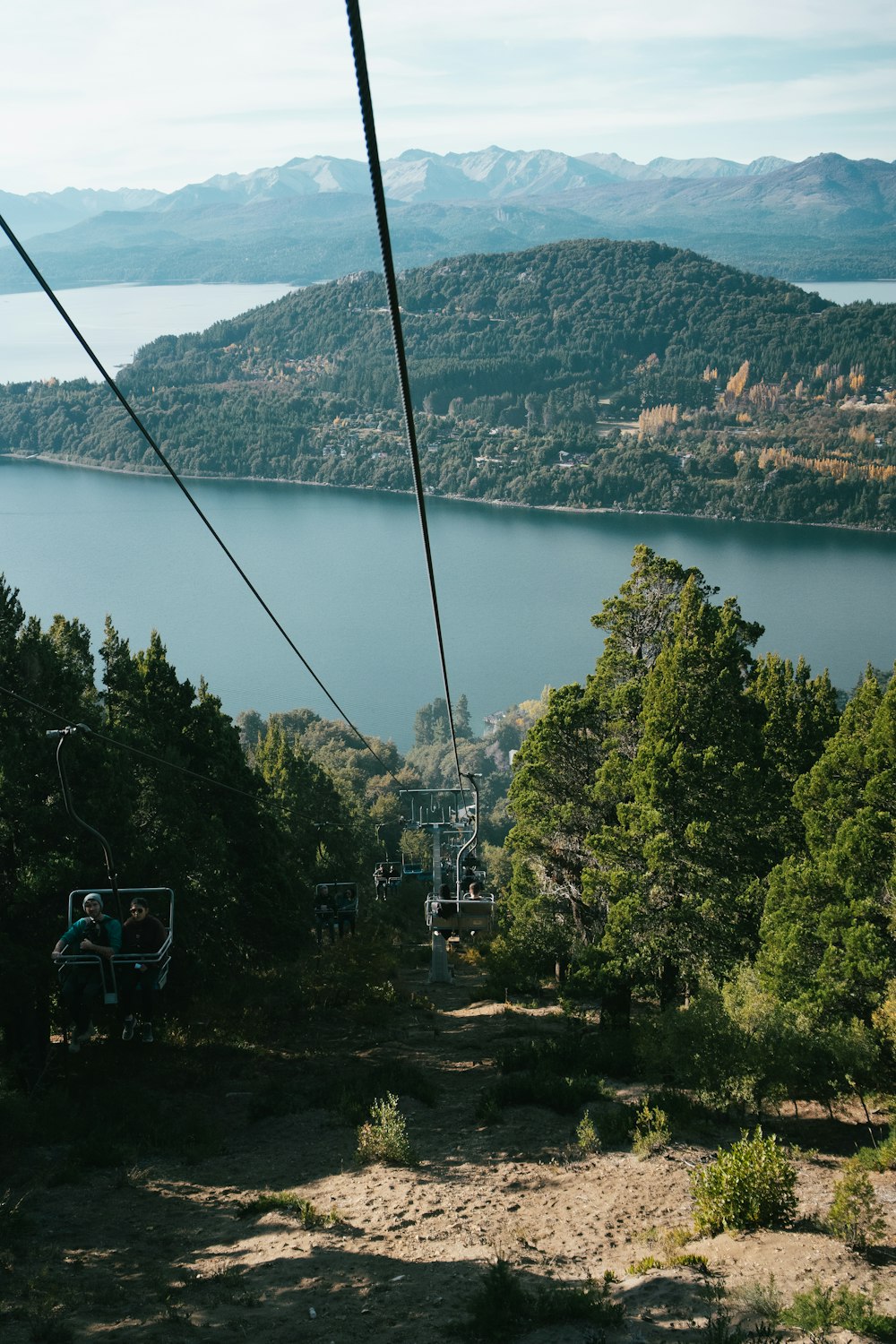 a view of a lake from a ski lift