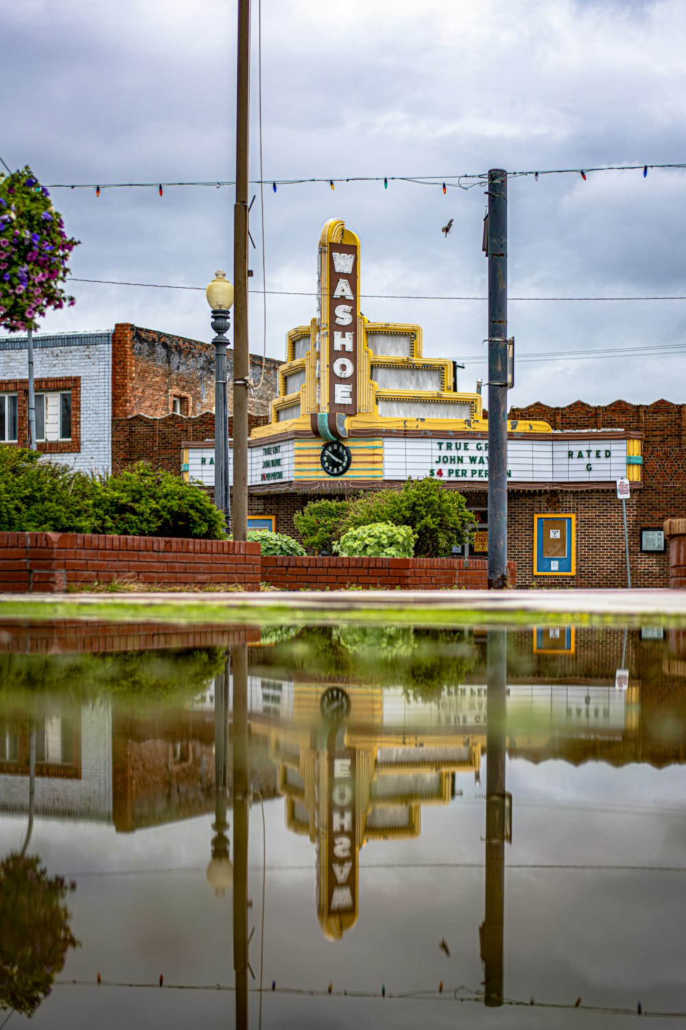 a reflection of a building in a body of water