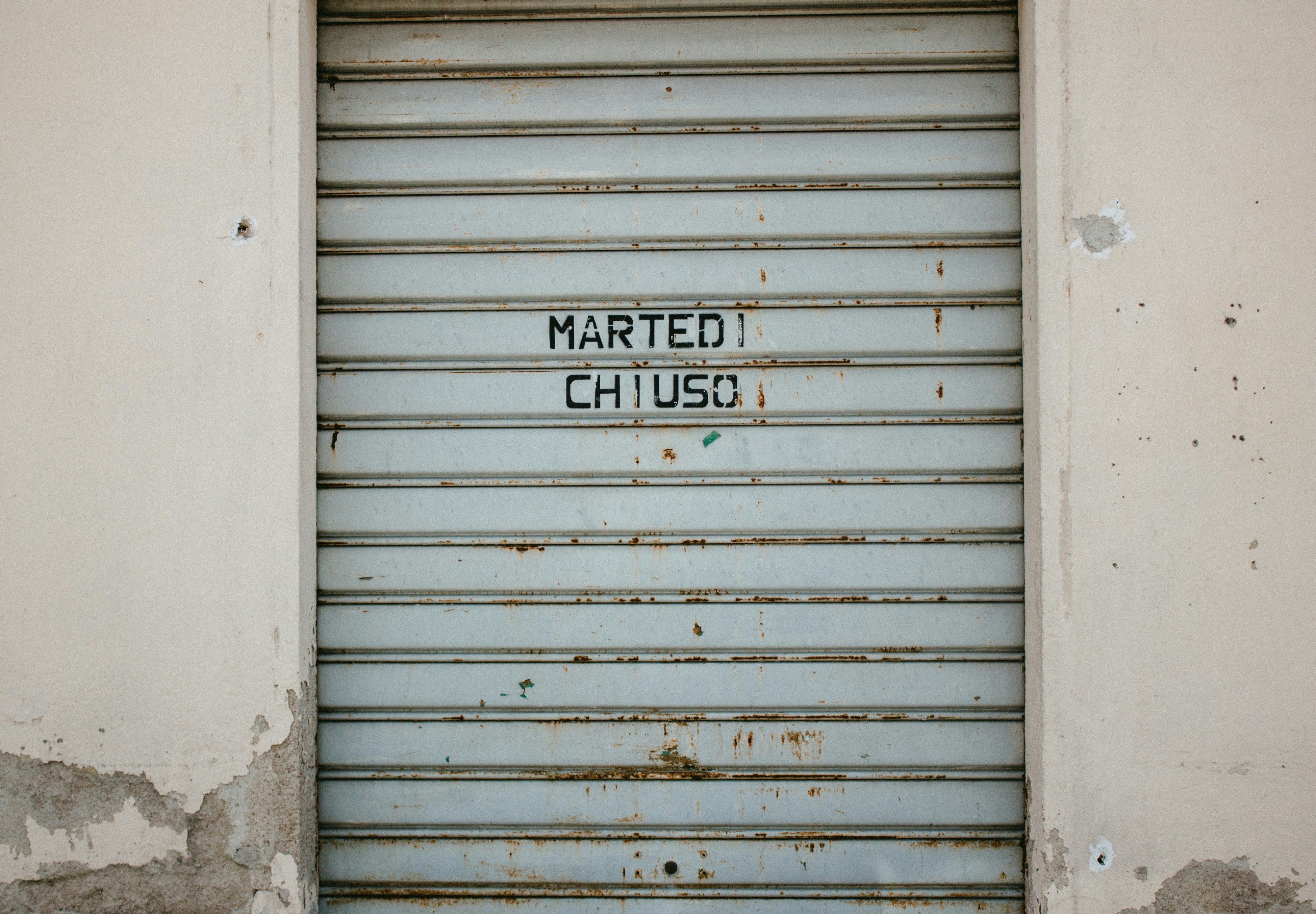 A closed garage door with the word married chugs written on it photo