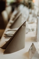 A restaurant table set with elegant, high-quality table linens and napkins.