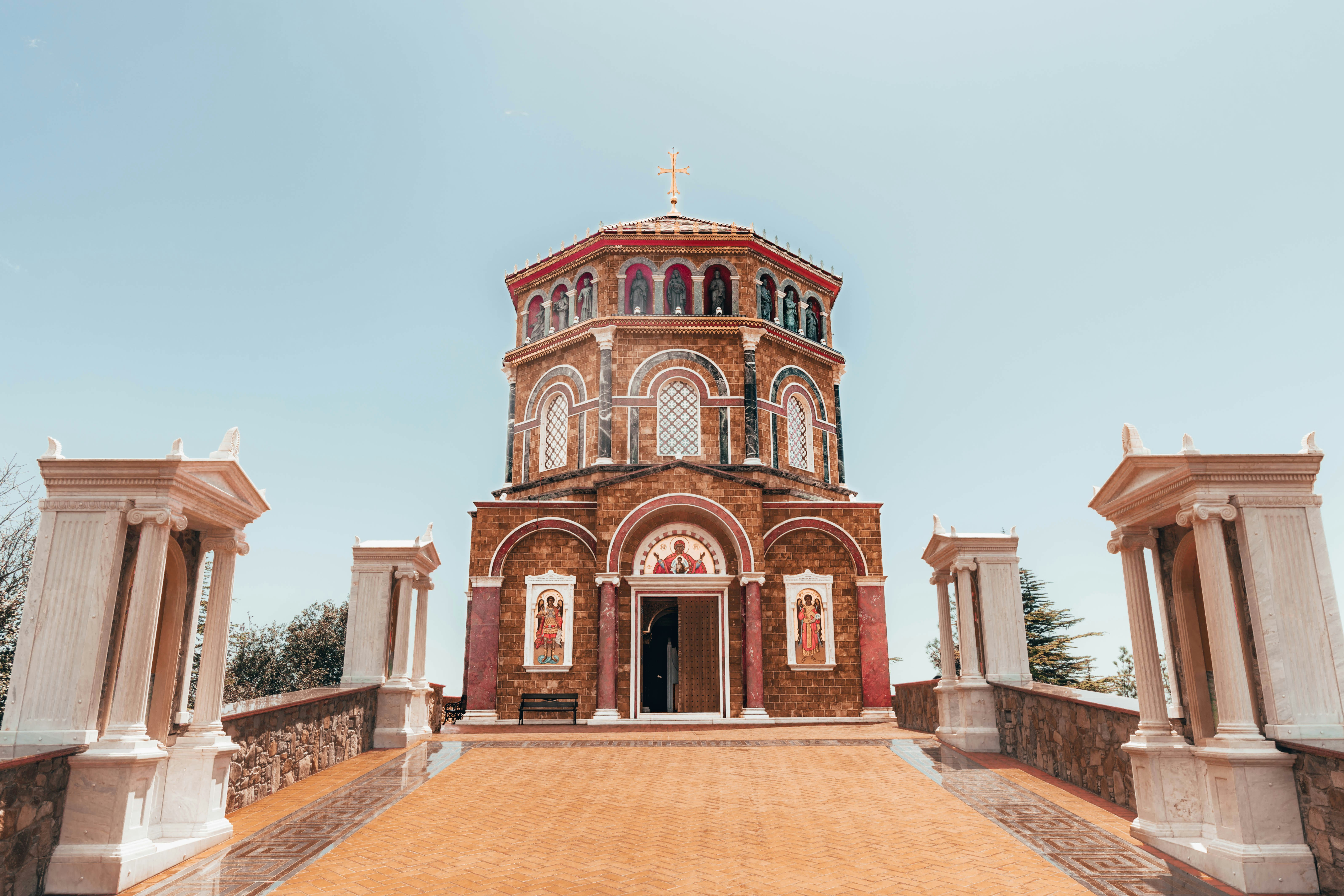 a small church with a cross on top of it, Throni, a wonder of the island of Cyprus