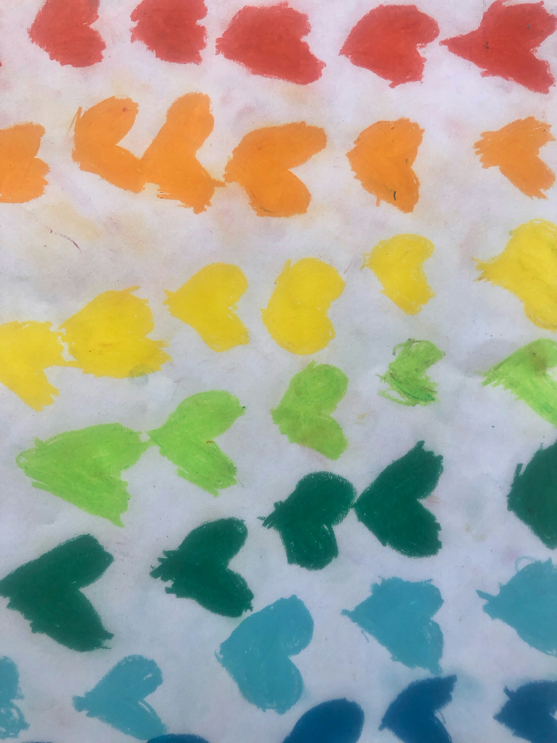 a group of different colors of paint on a white surface