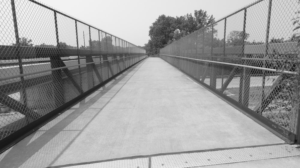 a black and white photo of a walkway