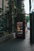 a vending machine sitting on the side of a road