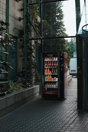a vending machine sitting on the side of a road