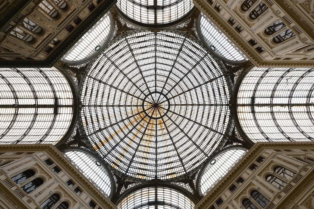 the ceiling of a building with many windows