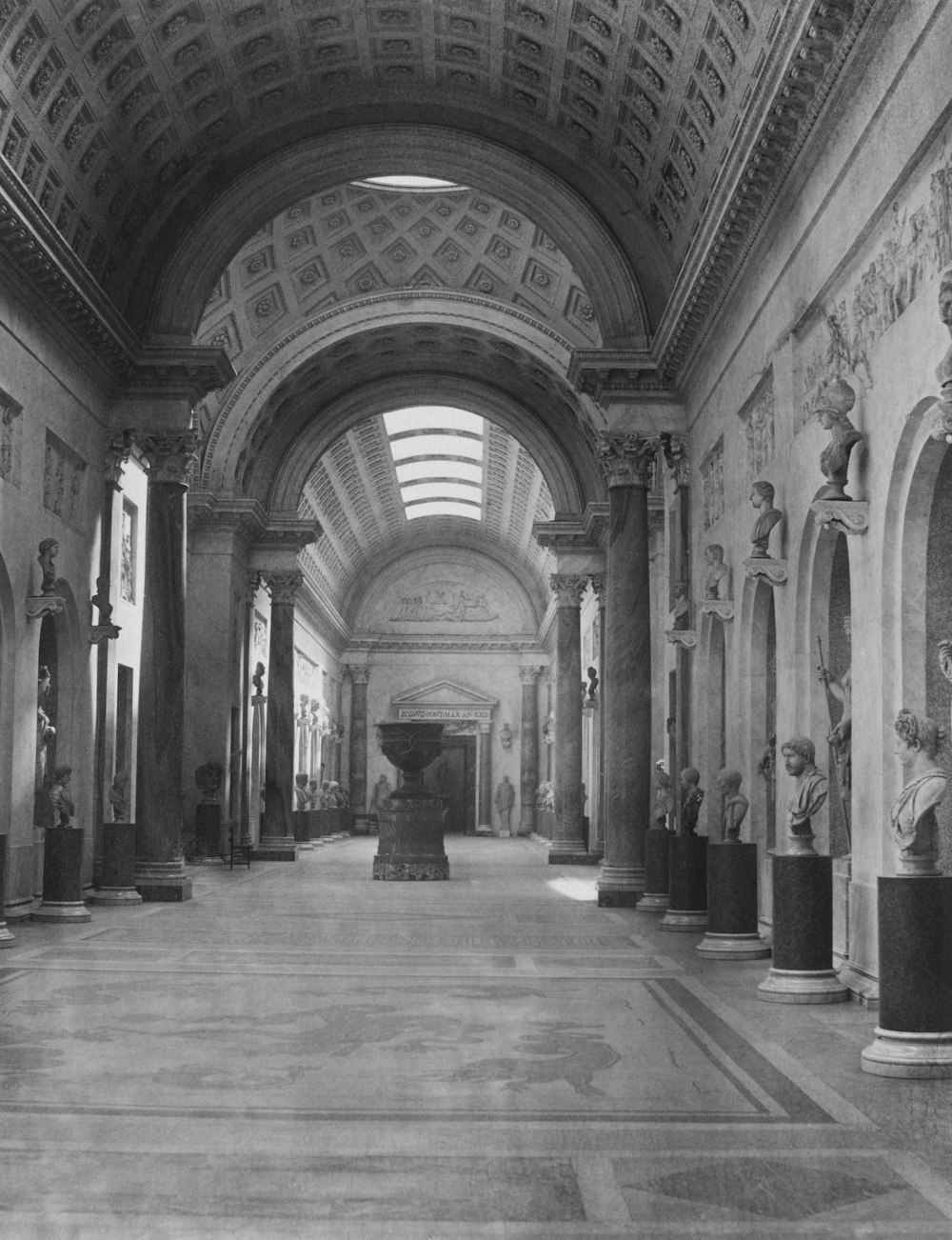 an old black and white photo of a hallway