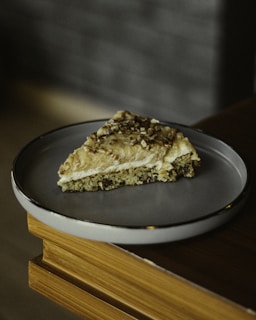 Lazy cake squares with a rustic look, sprinkled with crushed nuts on a cozy cocoa-accented background