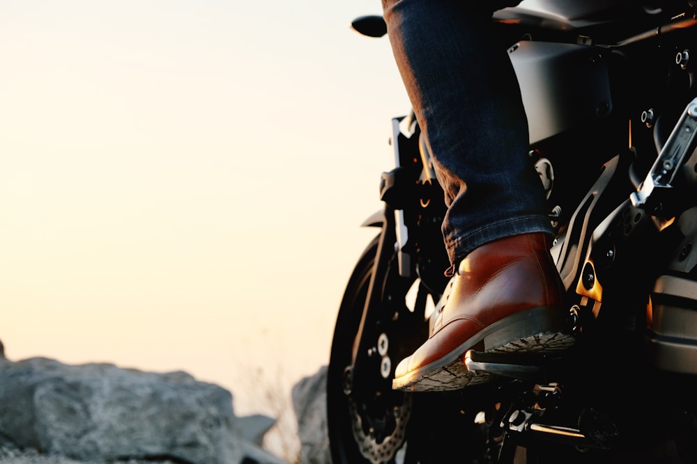 a person riding on the back of a motorcycle