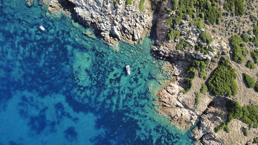 an aerial view of a boat in the water