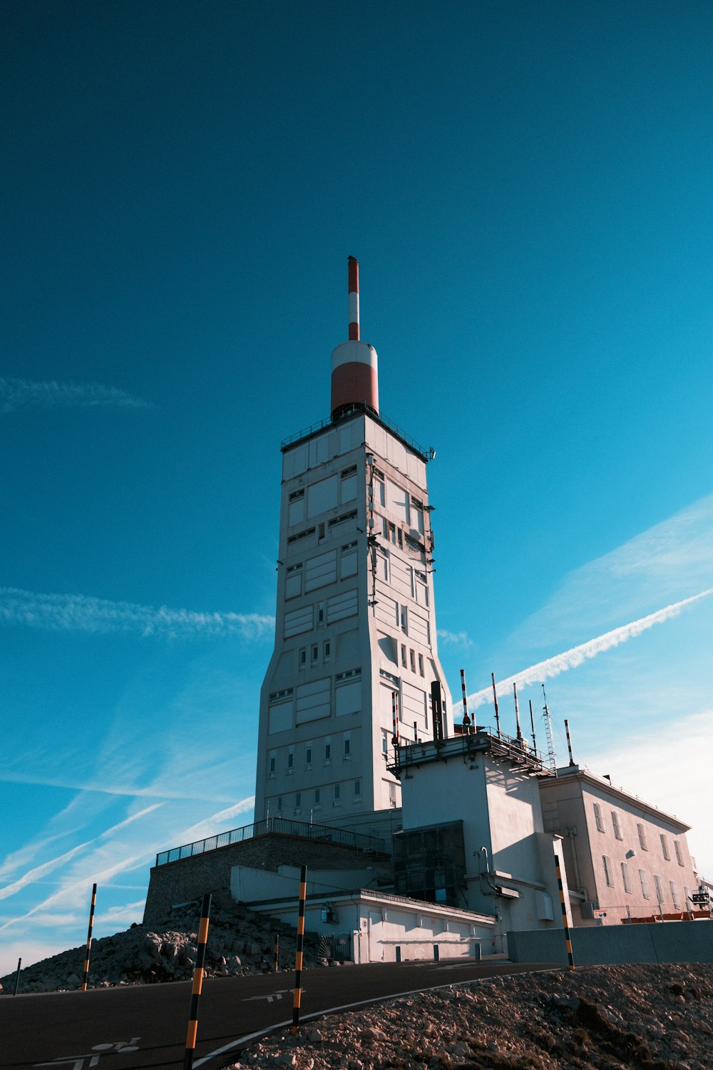 a tall white building sitting on top of a hill