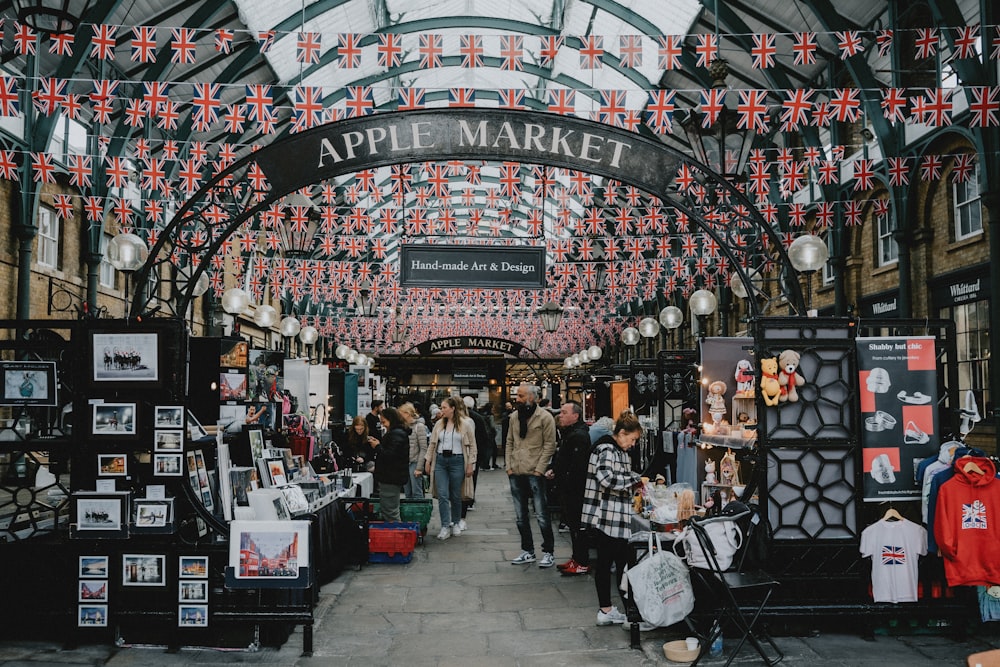 a group of people standing inside of a market