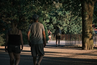 Lightly wooded park path during gentle morning light, perfect for a slow jog or zone 2 cardio session.