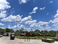 The exterior of a Doc Drop Ride vehicle parked outside a healthcare center on a sunny day.