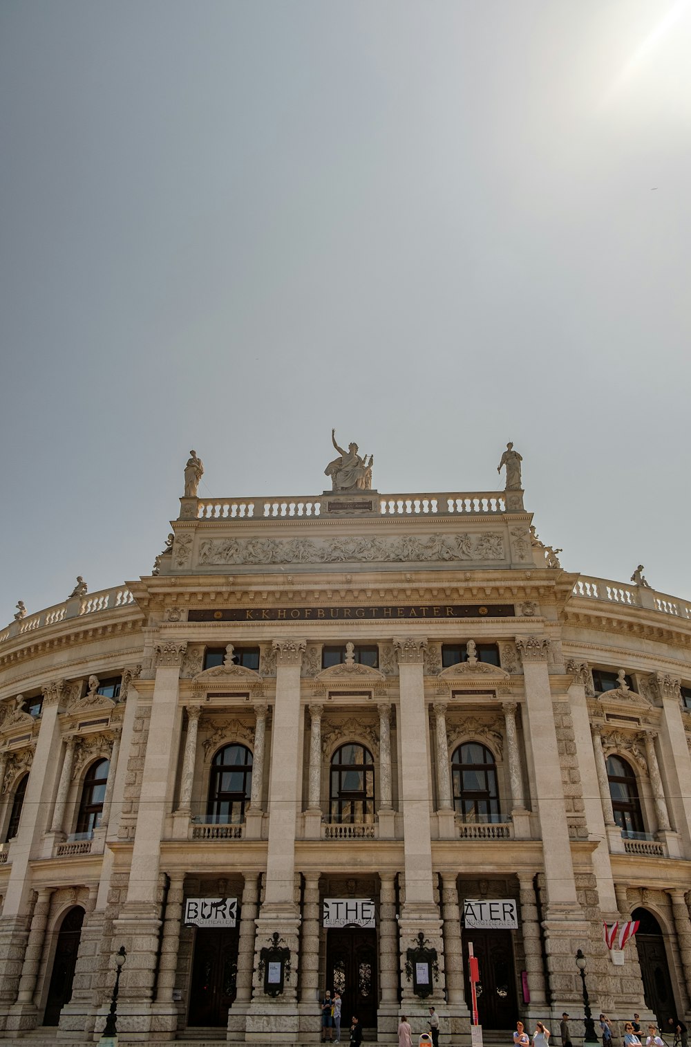 a large building with statues on top of it