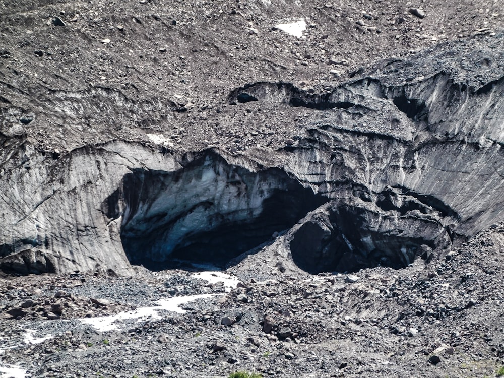 a very large hole in the side of a mountain