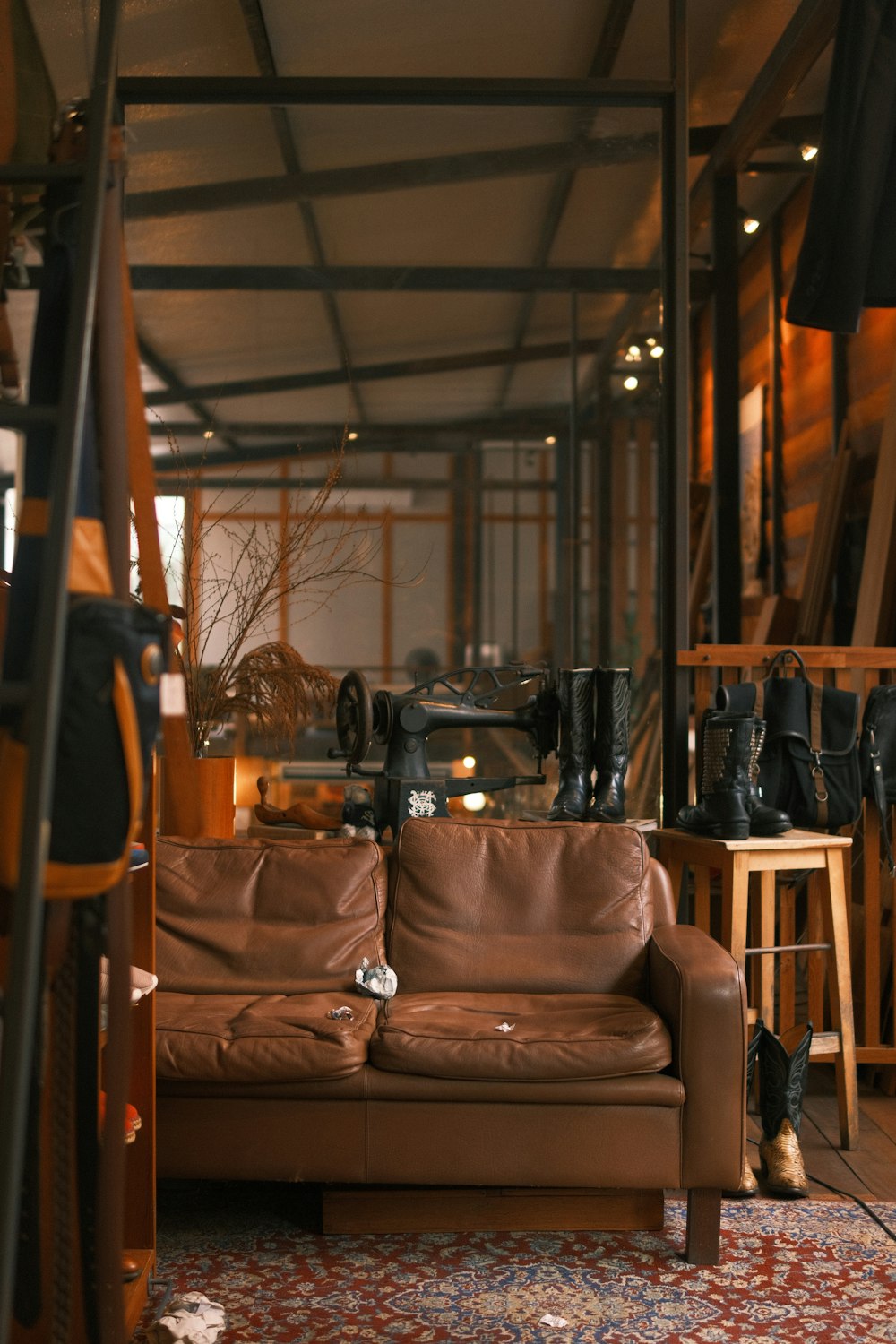 a living room with a brown leather couch