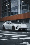 A sleek imported car parked in an urban setting.