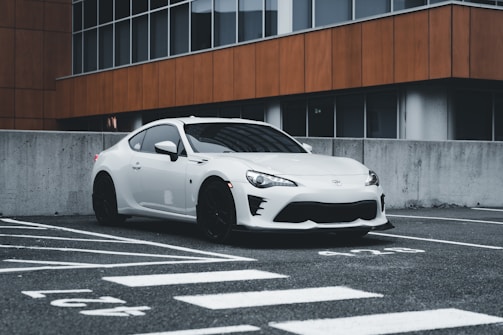 A sleek car parked in an urban setting.