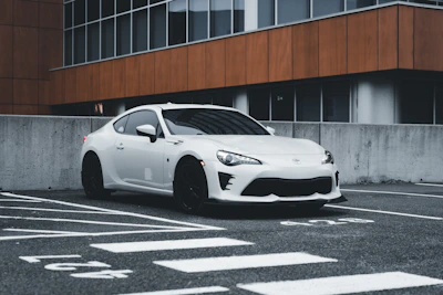 A sleek, modern car parked in an urban setting.