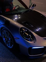 A stylish vehicle showcasing a unique carbon fiber hood wrap.