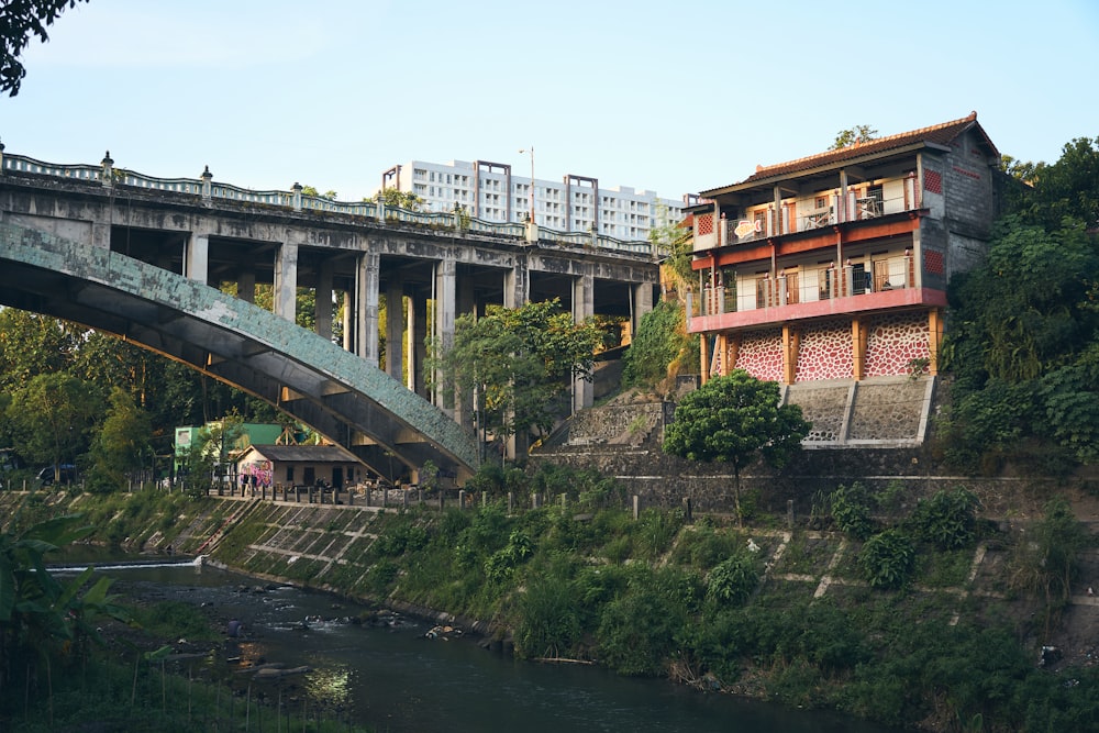 a bridge over a river next to a building