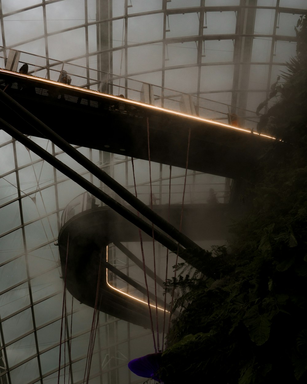 a large airplane hanging from the ceiling of a building