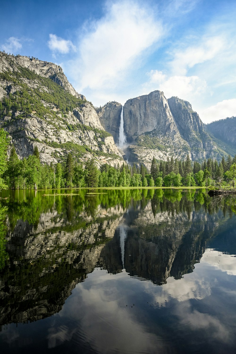 a mountain with a waterfall in the middle of it