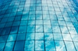 Close-up of a sparkling clean window reflecting a bright blue sky.