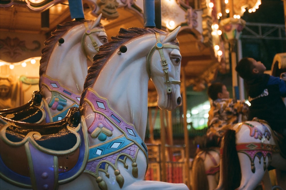 a close up of a merry go round horse