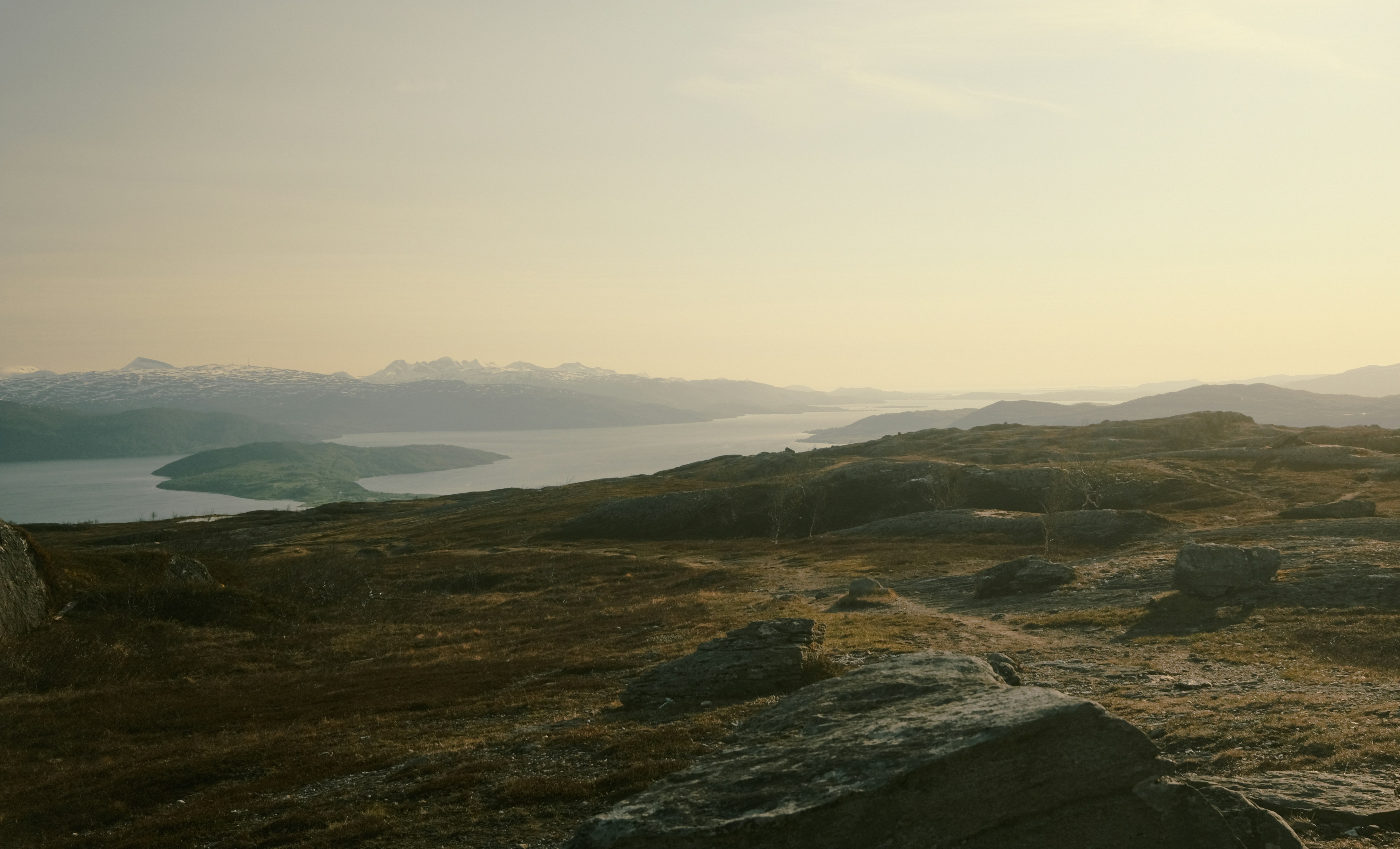 a person standing on top of a rocky hill