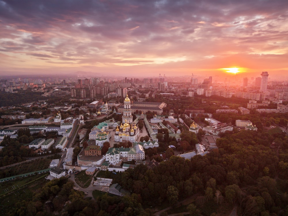 an aerial view of a city at sunset