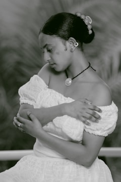 A serene setting with a model wearing various accessories.