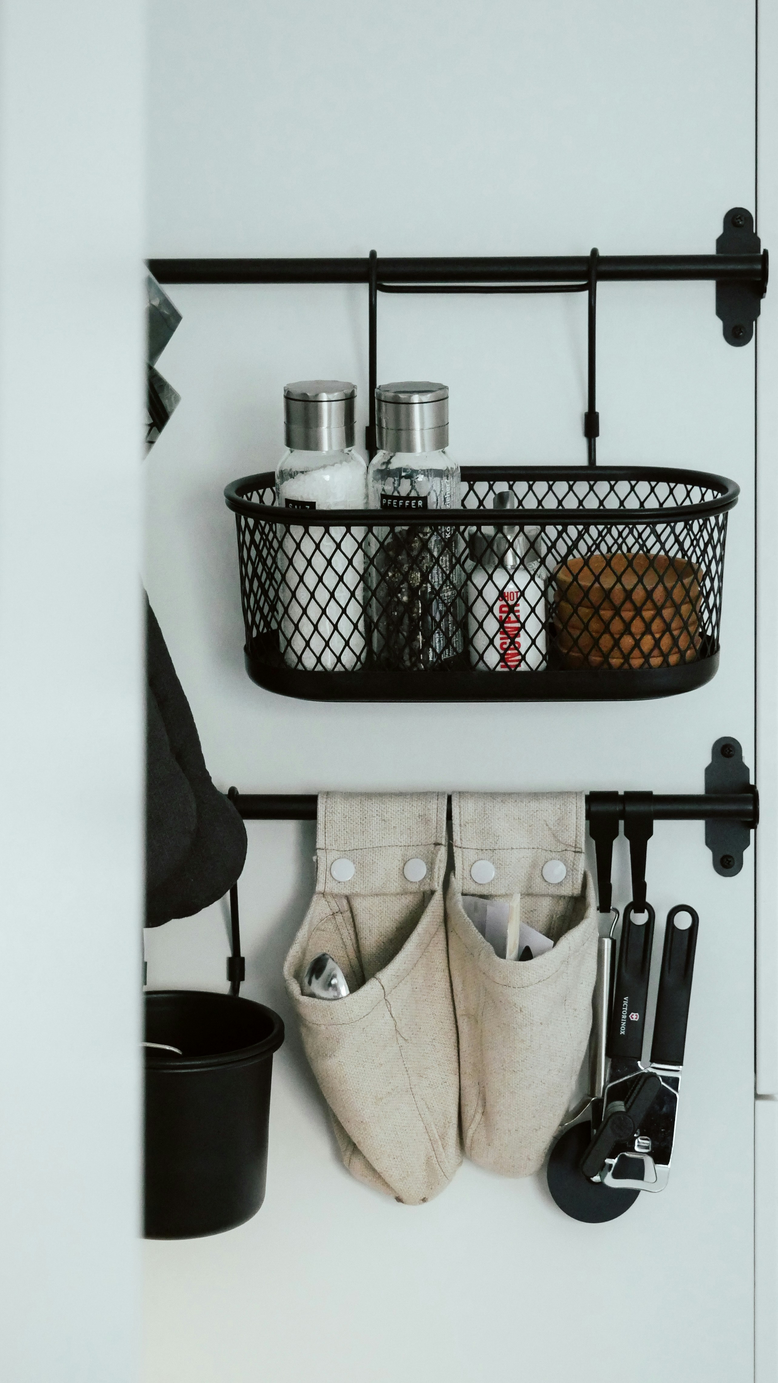 Organized kitchen utensils set on bright white background, modern minimalist arrangement