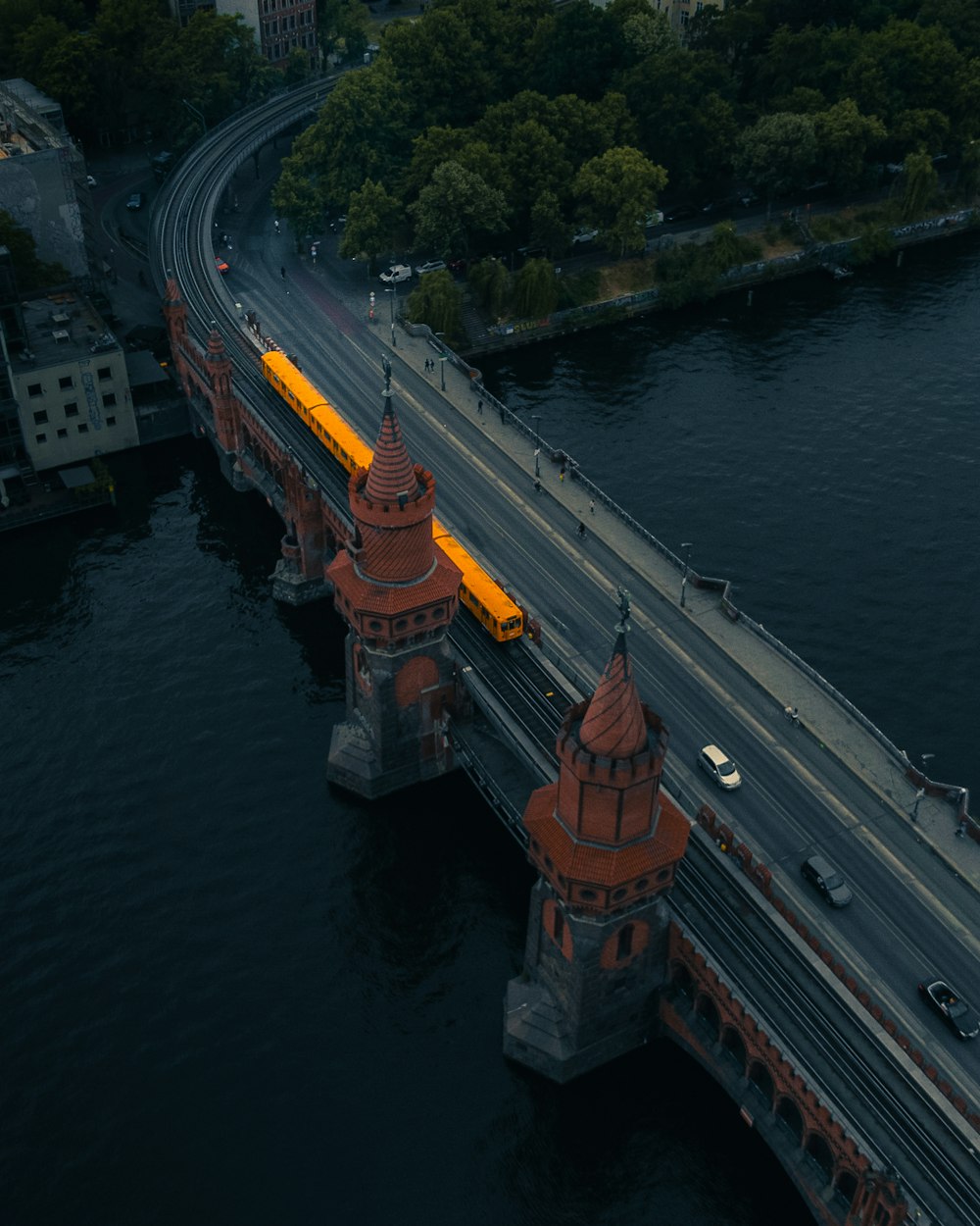 an aerial view of a bridge over a body of water