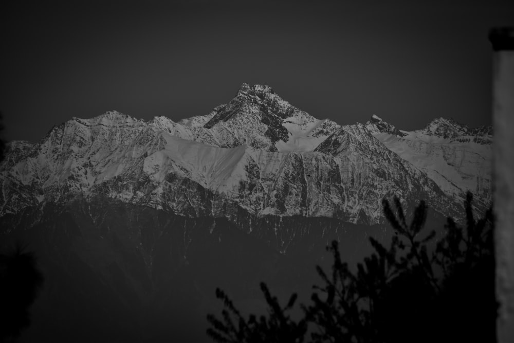 a black and white photo of a mountain range