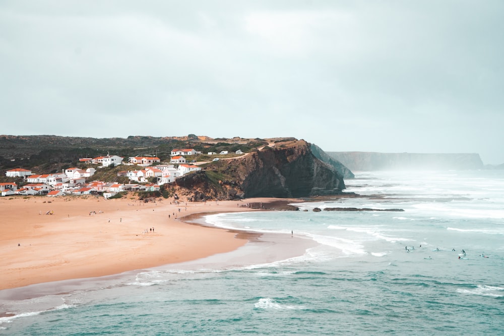 a view of a beach with people in the water