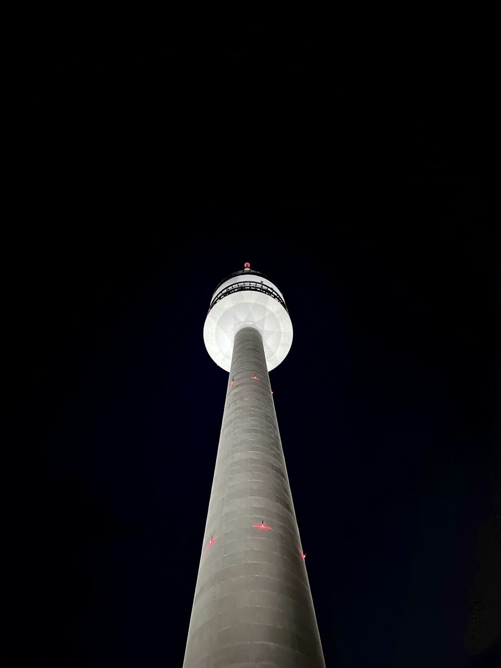 a tall tower with a light on top of it