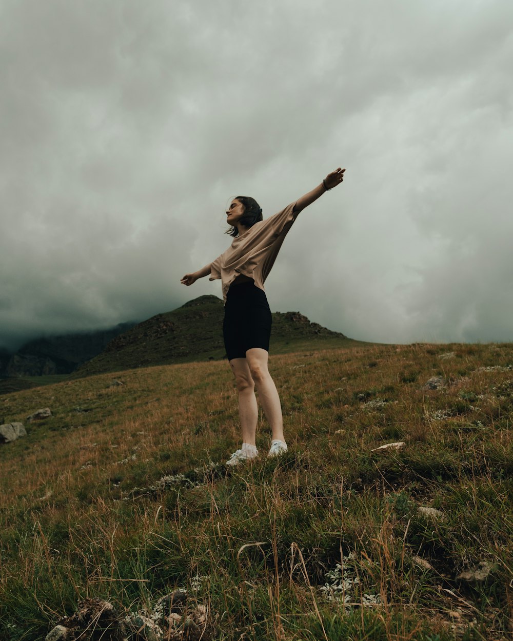 a man standing on top of a lush green field